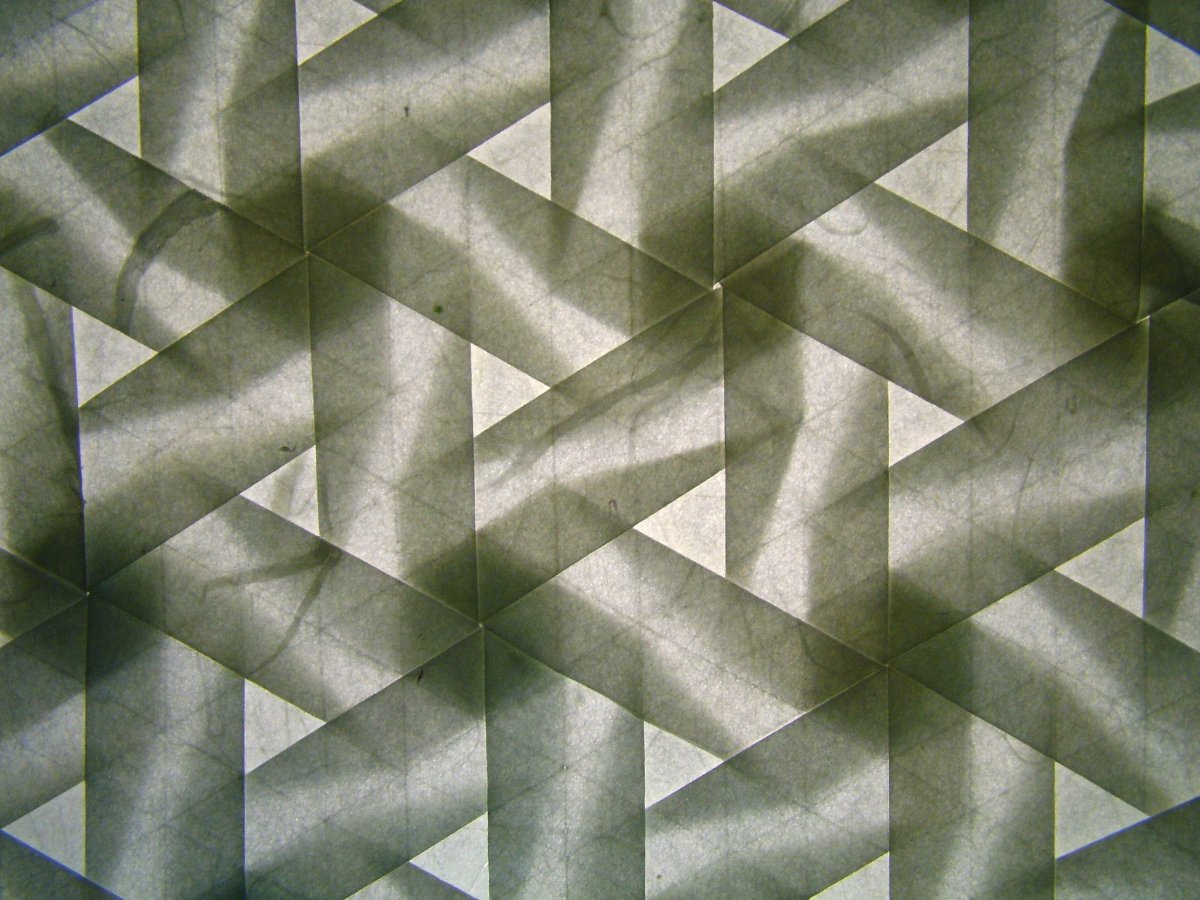 "Pinwheel tesselation, version 2, backlit," by Flickr user Eric Gjerde. https://www.flickr.com/photos/origomi/