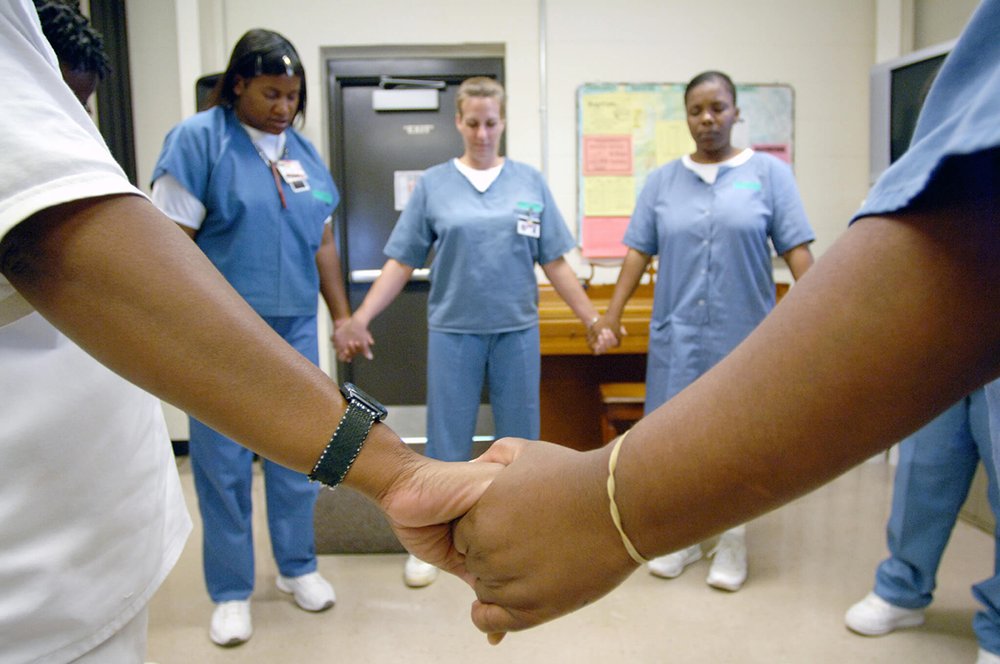 Title: Female Inmate Faith | Author: Inside CCA | Source: insidecca on Flickr | License: CC BY-ND 2.0