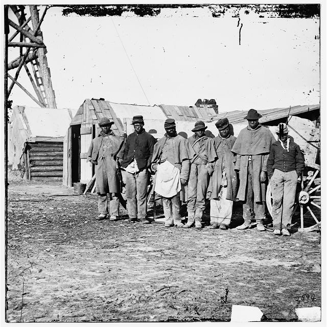 African Americans, freed from plantation slave holders, worked as teamsters at Bermuda Hundred to help the U.S. forces that freed them from the rebels of the civil war. | Credit: Hirst D. Milhollen and Donald H. Mugridge