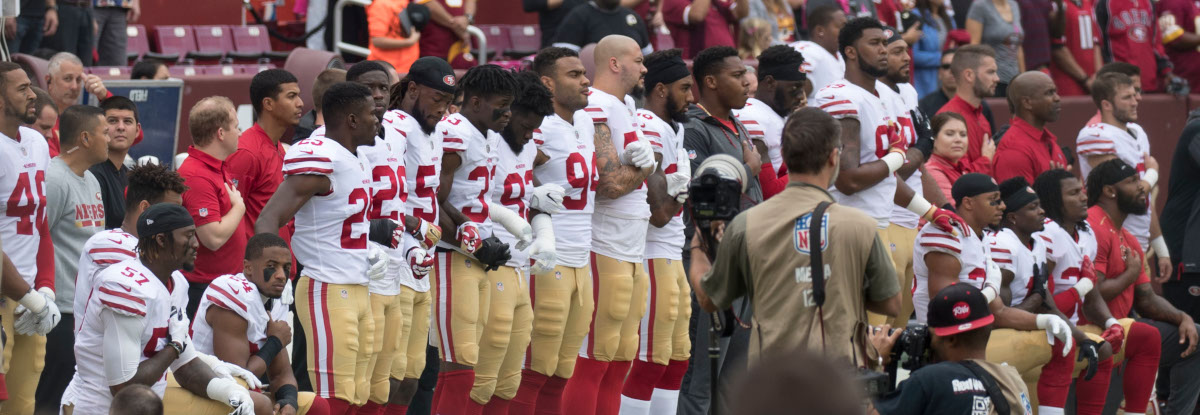 Title: San Francisco 49ers National Anthem Kneeling | Author: Keith Allison | Source: keithallison on Flickr | License: CC BY-SA 2.0