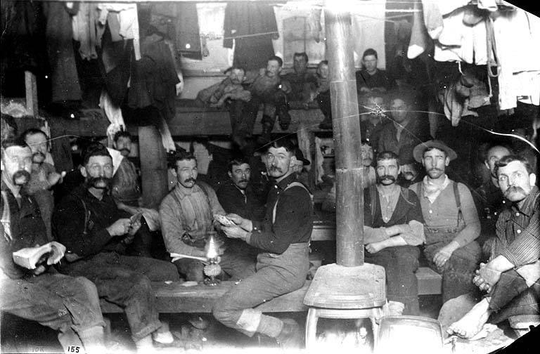 Loggers in bunkhouse interior, unidentified logging camp, Washington, 1892 | Author: Darius Kinsey | License: CC0