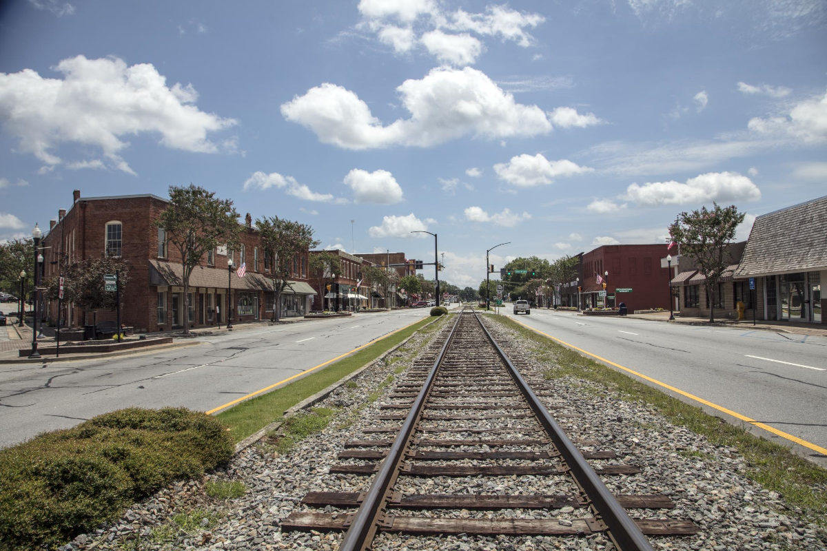 As in many Southern U.S. cities, a railroad track runs right down the middle of Commerce, Georgia's, main street | Credit: Carol M. Highsmith | License: Public Domain