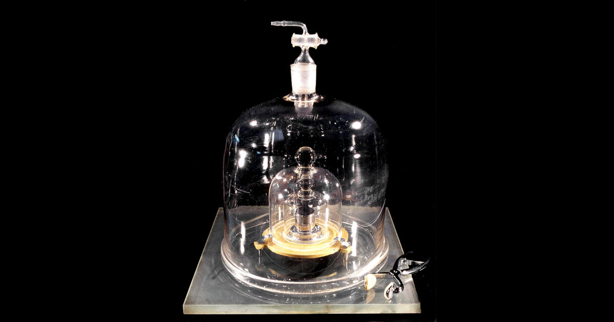 Originally, the kilogram was defined by a physical object, the cylinder pictured here, kept in a temperature and humidity-controlled vault in a series of nested bell jars. Because its mass was constantly changing over time, in 2019, the kilogram was redefined using a fundamental constant from quantum physics. | Title: International prototype of the kilogram aka Le Grand K. | Credit: BIPM | Source: NIST | License: CC BY-SA 3.0